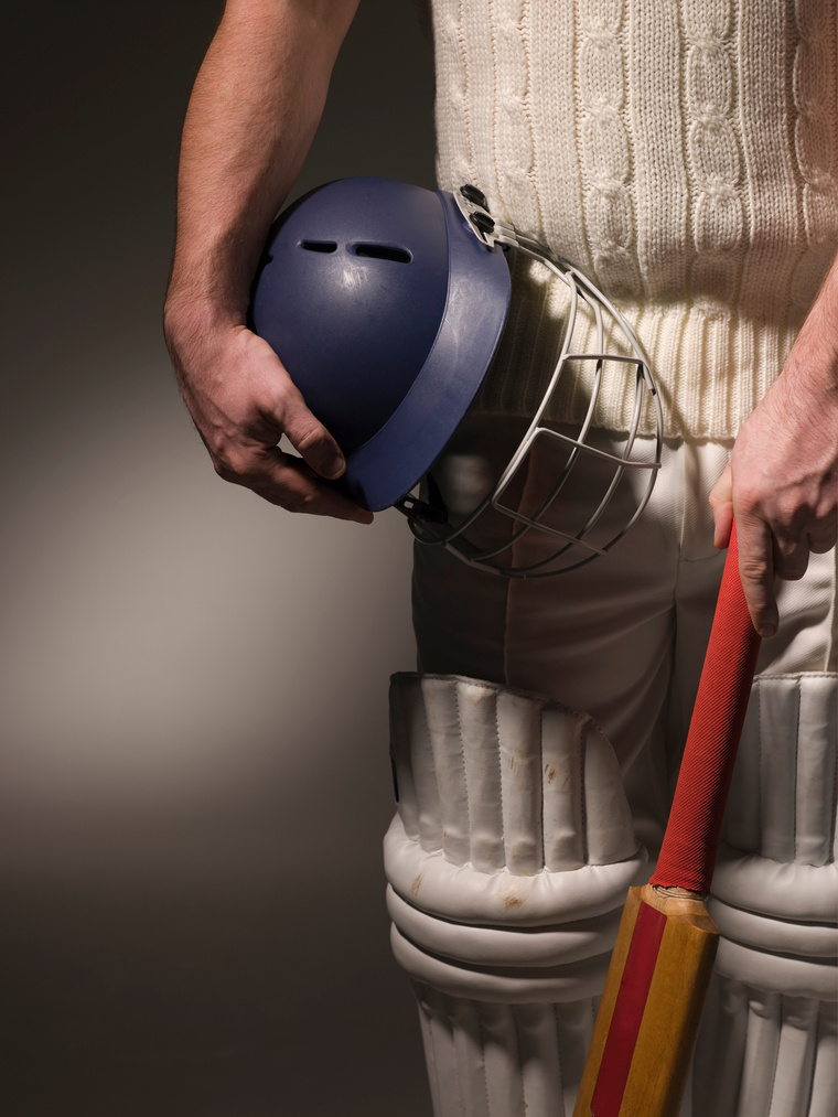 Person wearing safety padding for cricket